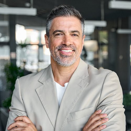 happy-confident-mid-aged-business-man-standing-in-2023-11-27-05-24-55-utc.jpg